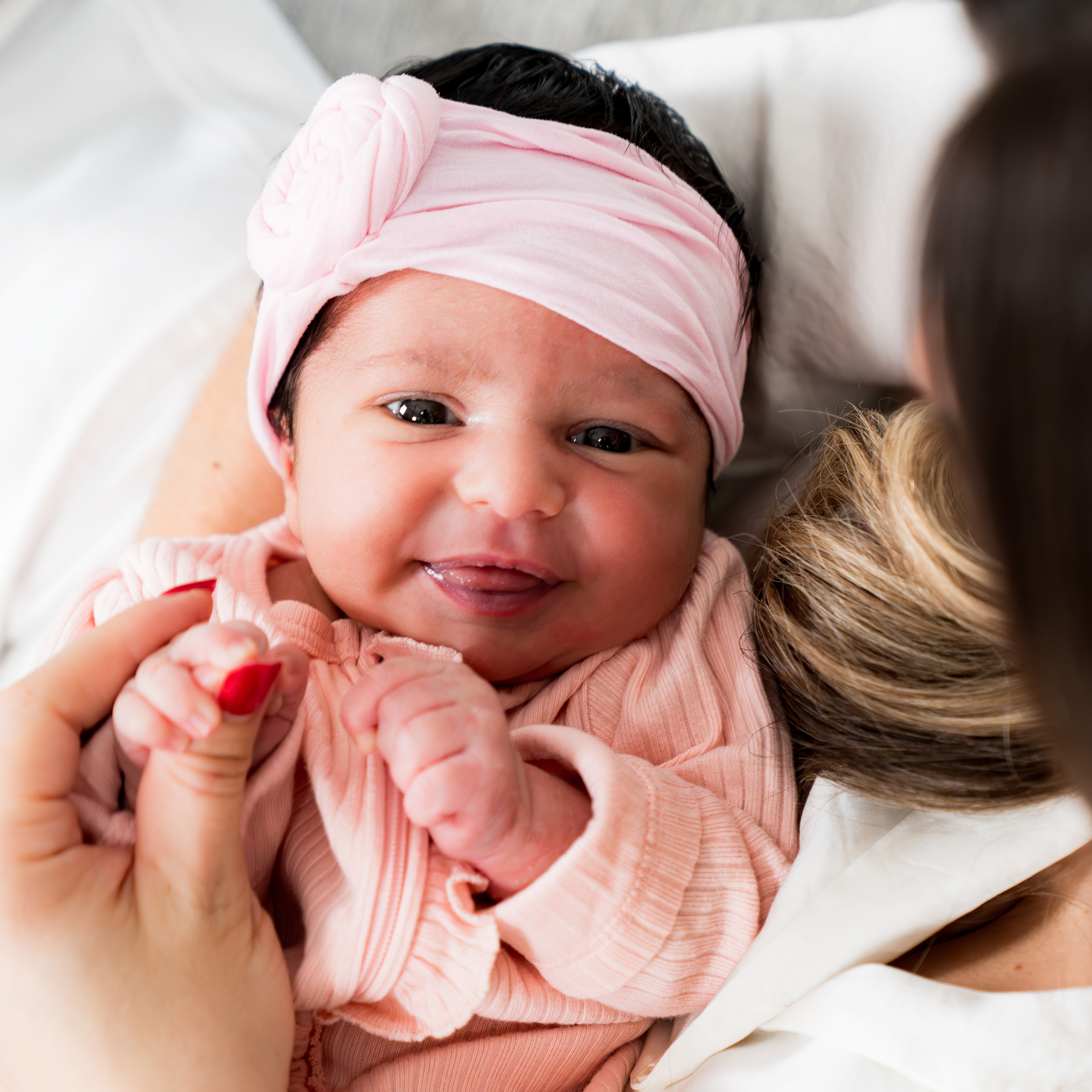 Baby in arms East End Lens